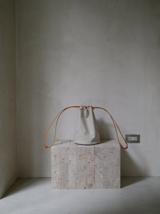 KAMARO'AN Woven Drawstring Bucket Bag