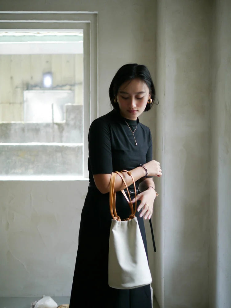 KAMARO'AN Ivory Woven Drawstring Bucket Bag