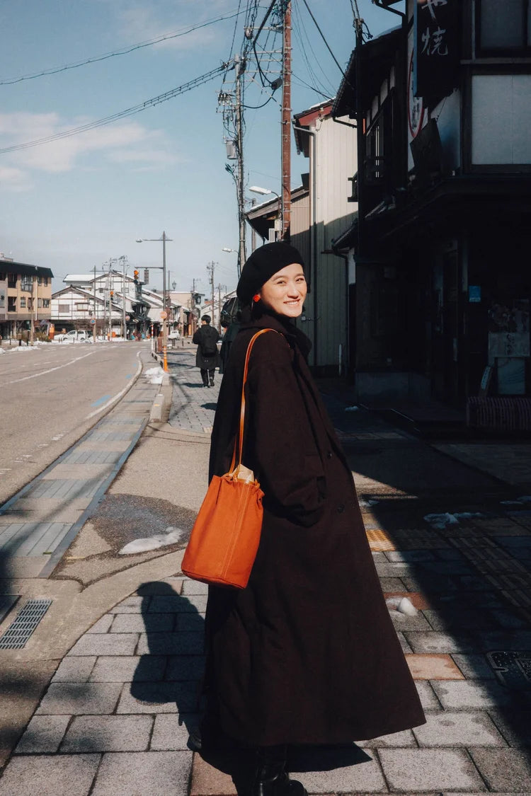 KAMARO'AN Naturally Dyed Woven Drawstring Bucket Bag